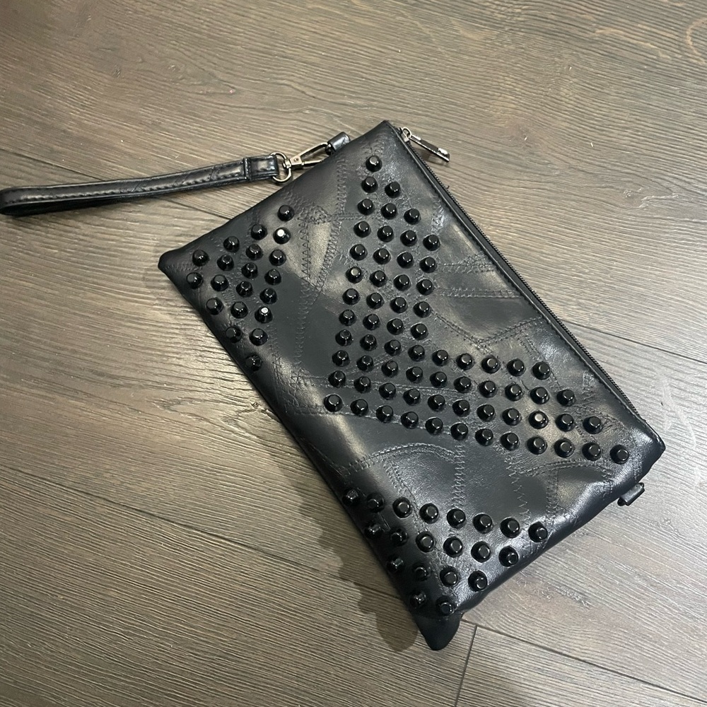 Cute Black Wristlet.  This can hold your phone and a small wallet.
